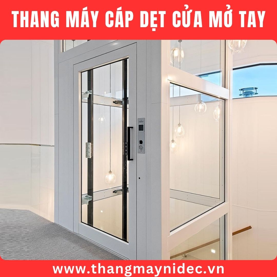 thang máy cáp dẹt cửa mở tay